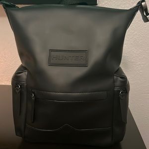 Small black Hunter Top Clip Backpack Rubberized Leather.